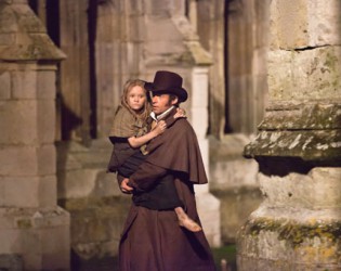 ISABELLE ALLEN as young Cosette and HUGH JACKMAN as Jean Valjean in Les Miserables