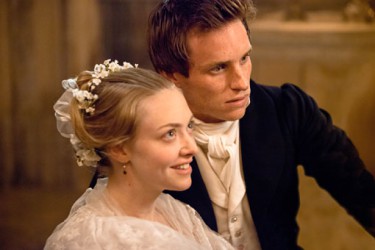 AMANDA SEYFRIED as Cosette and EDDIE REDMAYNE as Marius in Les Miserables
