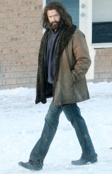 Hugh walks across the snow covered set in Picton