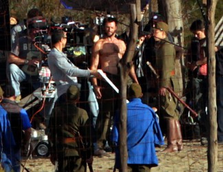 The cast and crew prepare for a take
